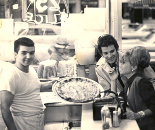 A young Nick Andrisano behind the pizza counter at his father's New York restaurant
